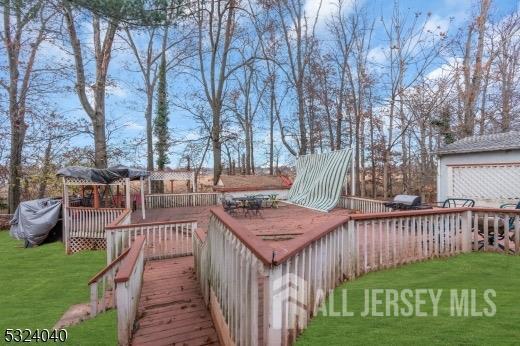 wooden terrace with a yard