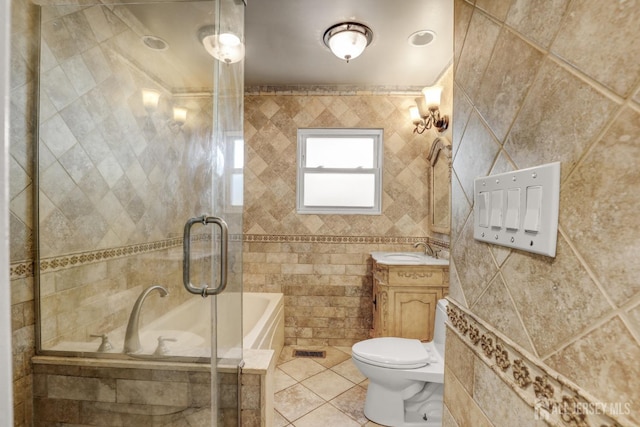 full bath featuring visible vents, tile walls, vanity, tile patterned floors, and toilet