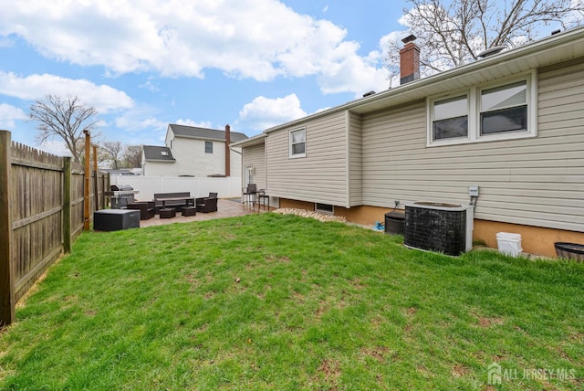 rear view of house with outdoor lounge area, a fenced backyard, a patio area, central air condition unit, and a lawn