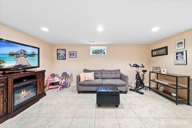 living room with light tile patterned floors, baseboards, recessed lighting, and visible vents
