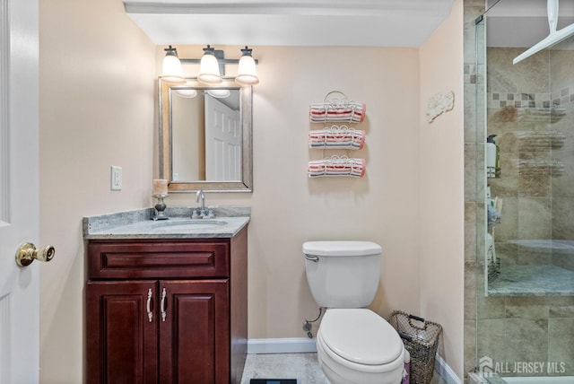 206 Redding Ave, South Plainfield, NJ 07080 - full bath featuring vanity, toilet, a shower stall, and baseboards