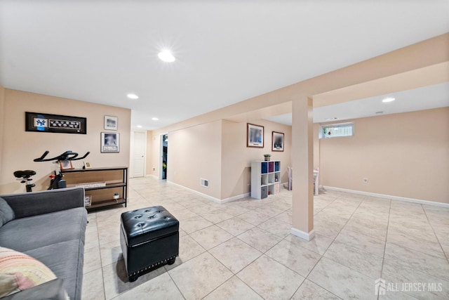 living room featuring recessed lighting, baseboards, and visible vents