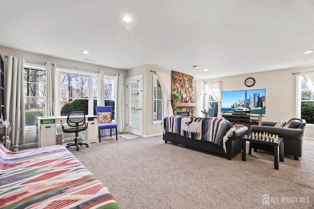 carpeted living room featuring access to outside