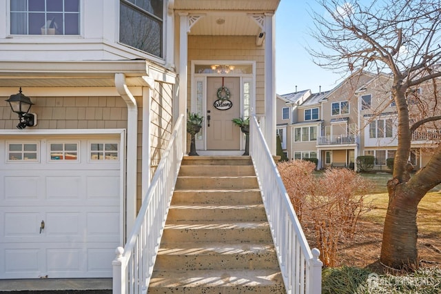 view of exterior entry with a garage