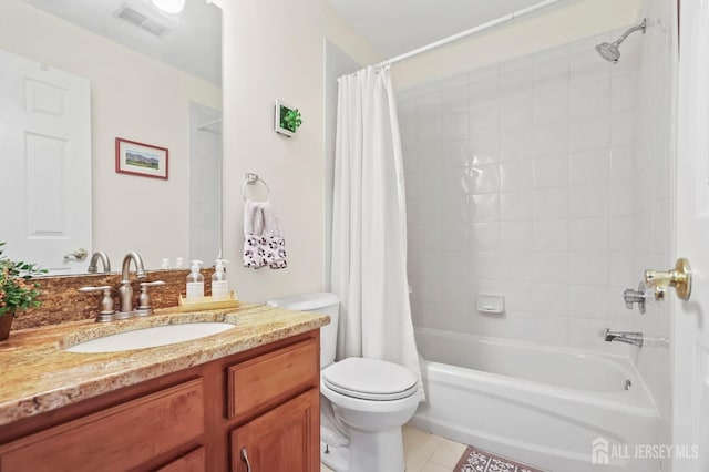 full bathroom featuring tile patterned floors, shower / bath combo, vanity, and toilet