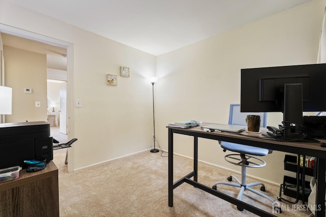 home office featuring carpet and baseboards