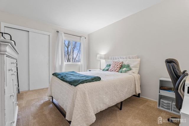 bedroom featuring a closet and carpet flooring