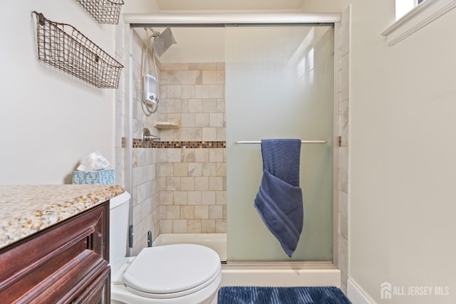 full bath with a stall shower and toilet