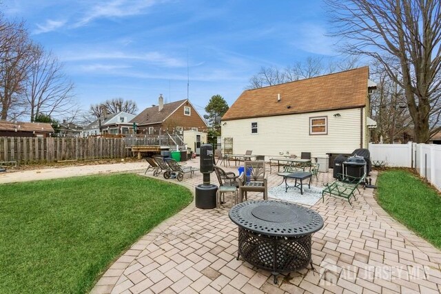 exterior space featuring a grill and a fenced backyard