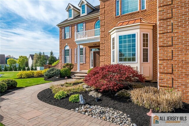 4 Van Gogh Ct, South Brunswick, NJ 08852 - entrance to property featuring brick siding and a balcony