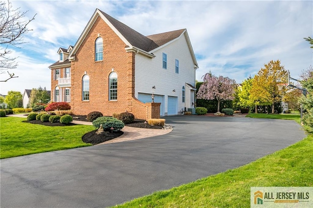 4 Van Gogh Ct, South Brunswick, NJ 08852 - view of property exterior with driveway, a garage, brick siding, and a lawn