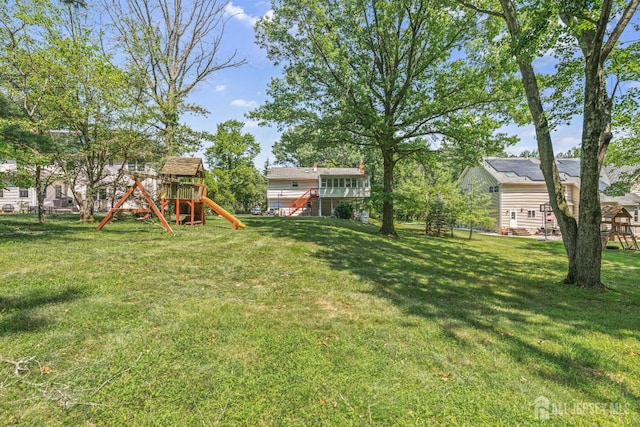 1099 New Dover Rd, Edison, NJ 08820 - view of green lawn featuring a playground