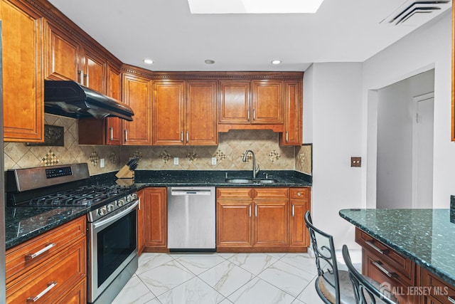 1099 New Dover Rd, Edison, NJ 08820 - kitchen featuring stainless steel appliances, under cabinet range hood, light marble finish floors, dark stone counters, and recessed lighting
