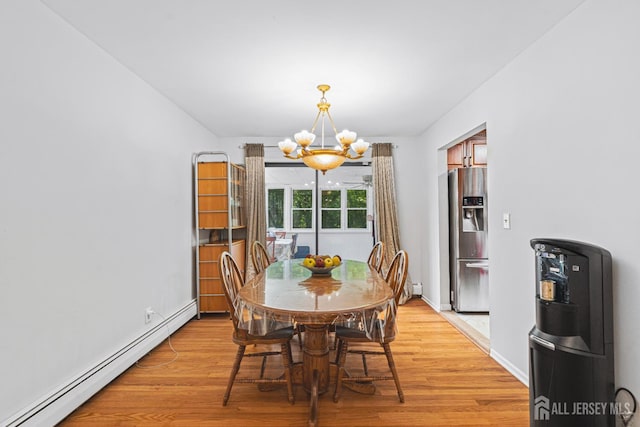 1099 New Dover Rd, Edison, NJ 08820 - dining area featuring a baseboard radiator, a chandelier, and light wood-type flooring