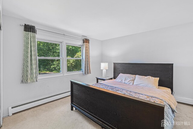 1099 New Dover Rd, Edison, NJ 08820 - bedroom featuring baseboard heating and carpet floors