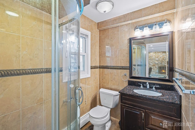 1099 New Dover Rd, Edison, NJ 08820 - bathroom featuring tile walls, vanity, a stall shower, and a baseboard radiator