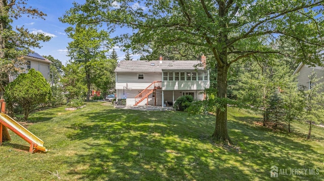 1099 New Dover Rd, Edison, NJ 08820 - view of grassy yard with stairway and a playground