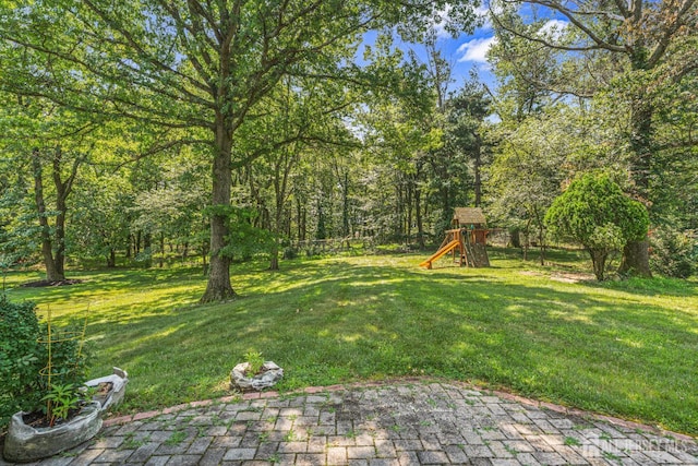 1099 New Dover Rd, Edison, NJ 08820 - view of yard featuring a playground and a patio area