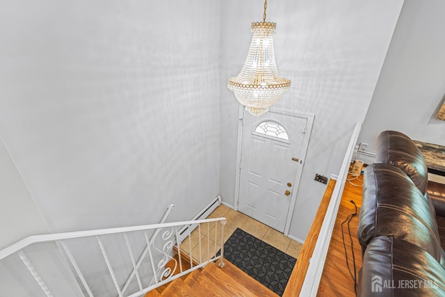 1099 New Dover Rd, Edison, NJ 08820 - tiled foyer entrance featuring a chandelier and a baseboard heating unit