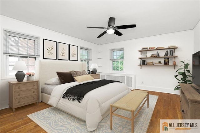 15 Kensington Ave, Trenton, NJ 08618 - bedroom featuring radiator, wood finished floors, and ceiling fan