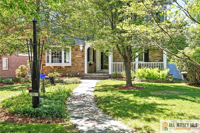 15 Kensington Ave, Trenton, NJ 08618 - view of property hidden behind natural elements featuring a front lawn, stone siding, and covered porch