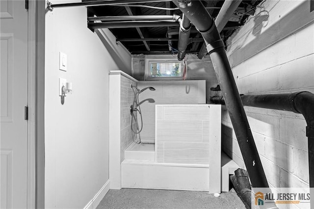 15 Kensington Ave, Trenton, NJ 08618 - full bathroom with a shower, a tub, and concrete block wall