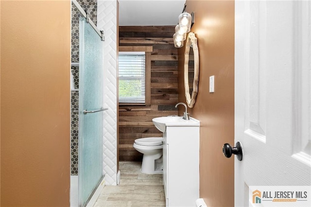 15 Kensington Ave, Trenton, NJ 08618 - full bathroom with wood walls, vanity, a shower stall, and wood finished floors