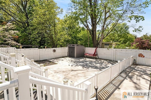 15 Kensington Ave, Trenton, NJ 08618 - wooden deck with a patio area, a fenced backyard, and view of wooded area