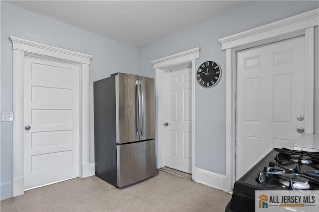 435 Ashley St, Perth Amboy, NJ 08861 - kitchen with freestanding refrigerator and black range with gas stovetop