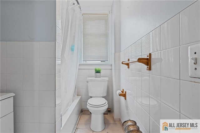 435 Ashley St, Perth Amboy, NJ 08861 - full bath featuring tile walls, tile patterned floors, shower / bath combo with shower curtain, and wainscoting