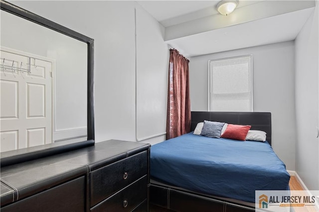 435 Ashley St, Perth Amboy, NJ 08861 - bedroom with wood finished floors