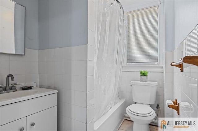 435 Ashley St, Perth Amboy, NJ 08861 - bathroom with tile walls, vanity, shower / bath combo, tile patterned flooring, and a wainscoted wall