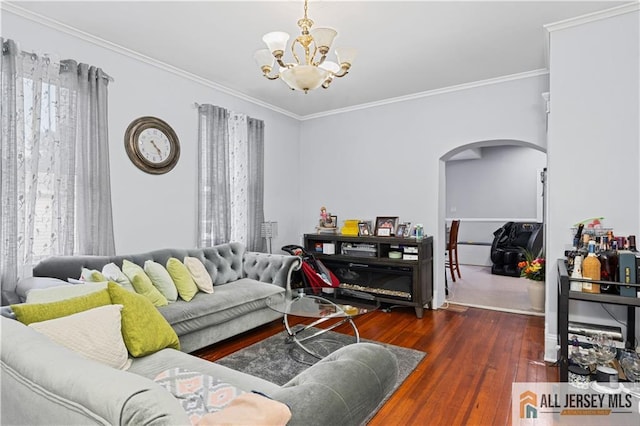 435 Ashley St, Perth Amboy, NJ 08861 - living area with arched walkways, a chandelier, hardwood / wood-style floors, plenty of natural light, and crown molding