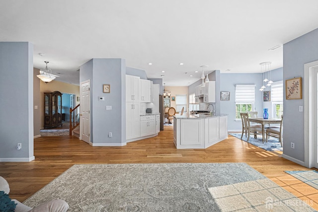 3 Devon Ct, Monroe, NJ 08831 - living room featuring light wood-type flooring, baseboards, a chandelier, and recessed lighting