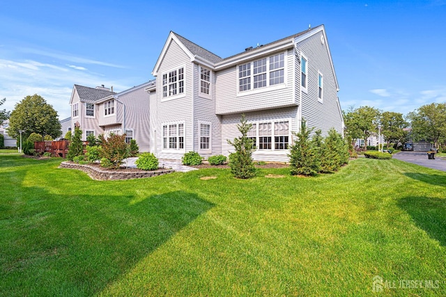 3 Devon Ct, Monroe, NJ 08831 - rear view of house featuring a yard