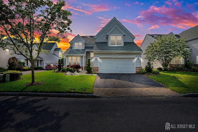 3 Devon Ct, Monroe, NJ 08831 - traditional-style home featuring driveway, an attached garage, a front yard, and a shingled roof