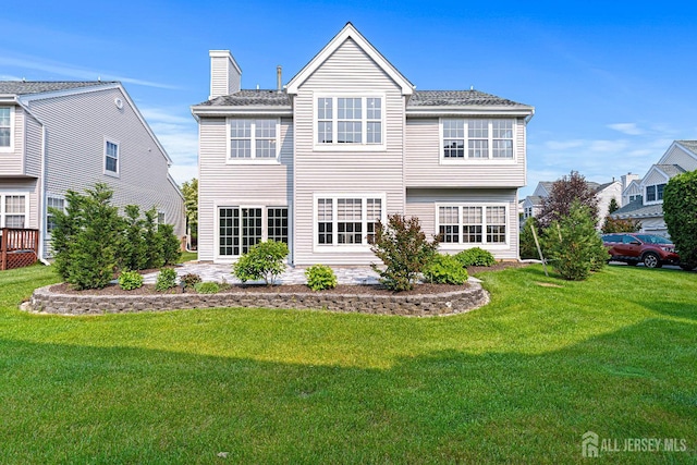 3 Devon Ct, Monroe, NJ 08831 - back of property with a lawn, a chimney, and a patio area