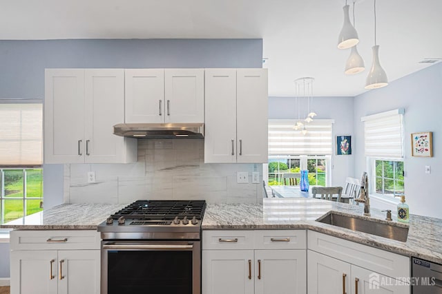 3 Devon Ct, Monroe, NJ 08831 - kitchen featuring gas stove, a sink, under cabinet range hood, and white cabinetry