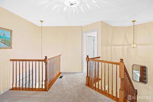 3 Devon Ct, Monroe, NJ 08831 - hall with an upstairs landing, carpet flooring, baseboards, and a chandelier