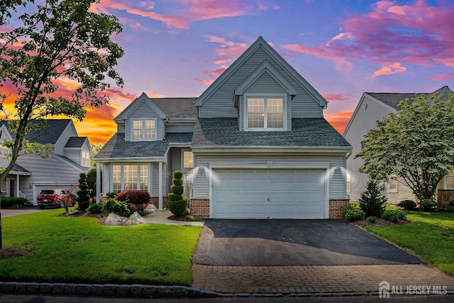 3 Devon Ct, Monroe, NJ 08831 - traditional home featuring asphalt driveway, a shingled roof, a garage, and a front yard
