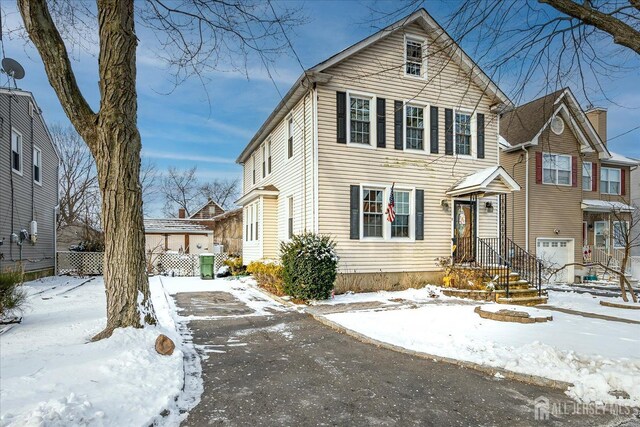 front facade with a garage