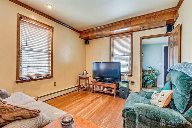 living room featuring crown molding, hardwood / wood-style flooring, and baseboard heating