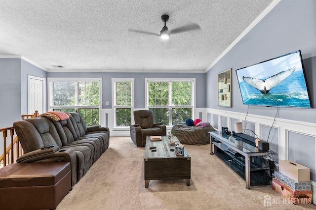 6 Amethyst Way, Franklin Twsp, NJ 08823 - carpeted living area featuring a ceiling fan, ornamental molding, healthy amount of natural light, a textured ceiling, and wainscoting