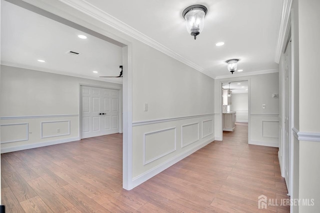495 Newport Way Unit B, Monroe, NJ 08831 - corridor with a decorative wall, light wood-style flooring, visible vents, and crown molding
