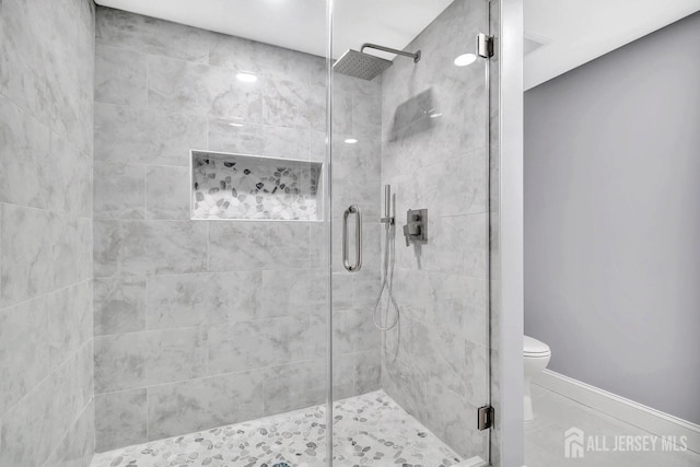 495 Newport Way Unit B, Monroe, NJ 08831 - bathroom featuring tile patterned floors, a stall shower, and toilet