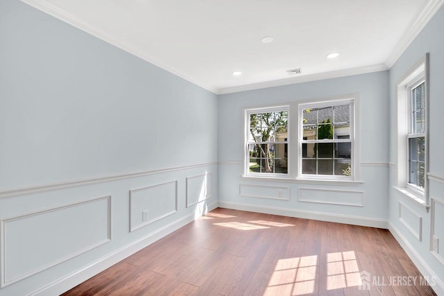 495 Newport Way Unit B, Monroe, NJ 08831 - unfurnished room featuring wood finished floors, ornamental molding, a decorative wall, recessed lighting, and wainscoting