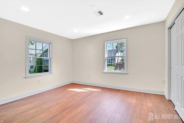 495 Newport Way Unit B, Monroe, NJ 08831 - unfurnished bedroom with light wood-style flooring, visible vents, baseboards, and multiple windows