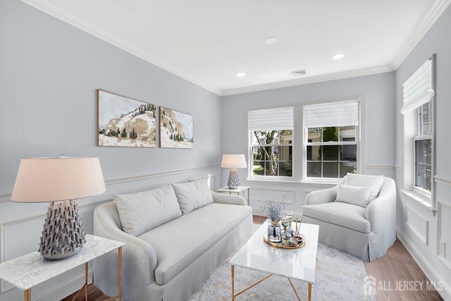 495 Newport Way Unit B, Monroe, NJ 08831 - living area featuring ornamental molding, wood finished floors, healthy amount of natural light, recessed lighting, and wainscoting