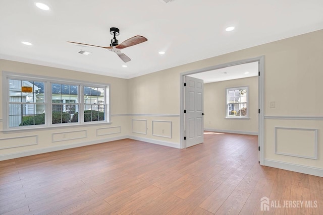 495 Newport Way Unit B, Monroe, NJ 08831 - spare room featuring light wood-type flooring, a wealth of natural light, a wainscoted wall, and ceiling fan