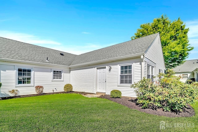 495 Newport Way Unit B, Monroe, NJ 08831 - back of property featuring a lawn and roof with shingles